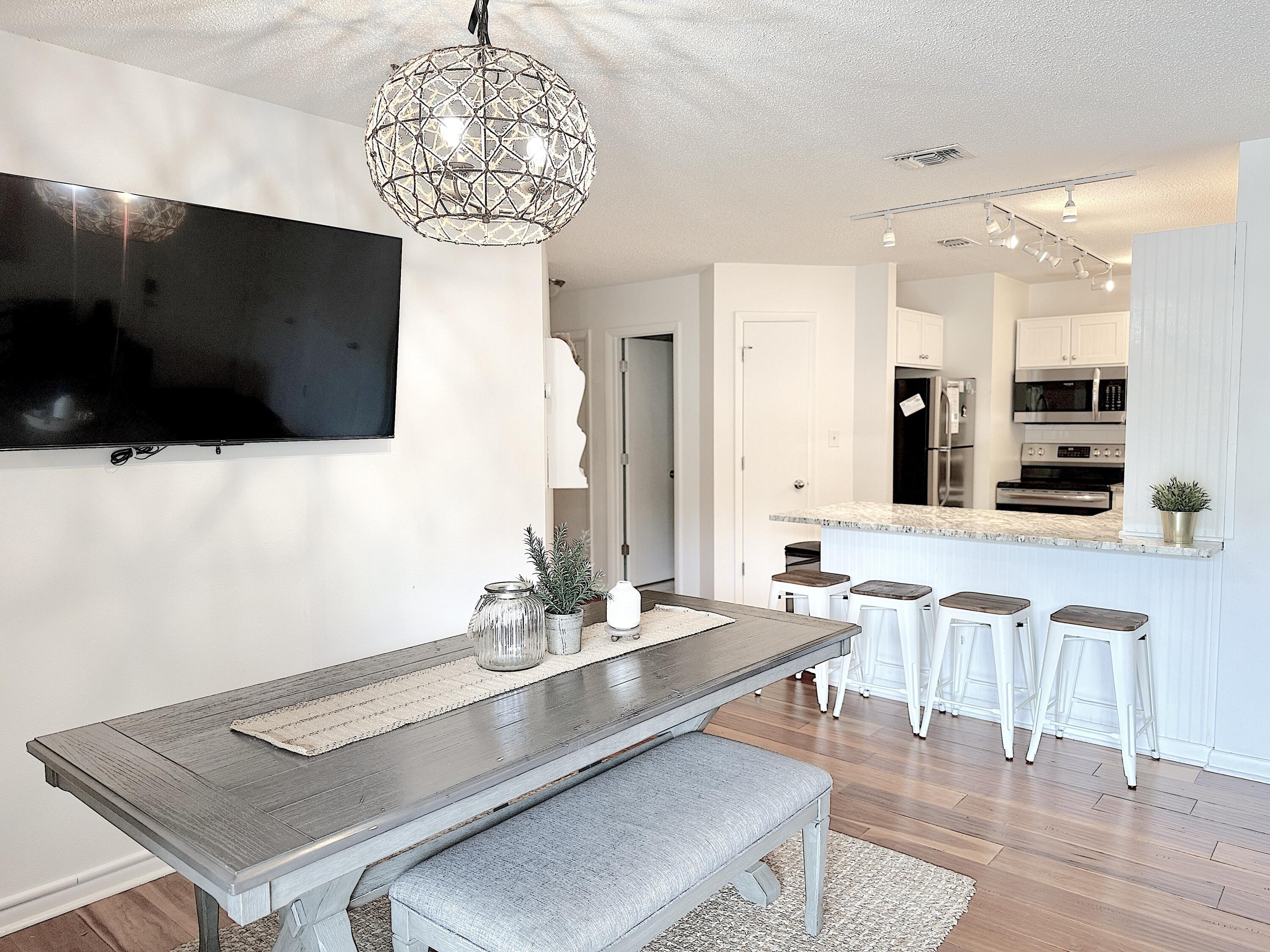 3799 East County Highway 30A, Unit E12 Santa Rosa Beach, FL 32459 - Photo 7 of 34 a living room with furniture and a flat screen tv