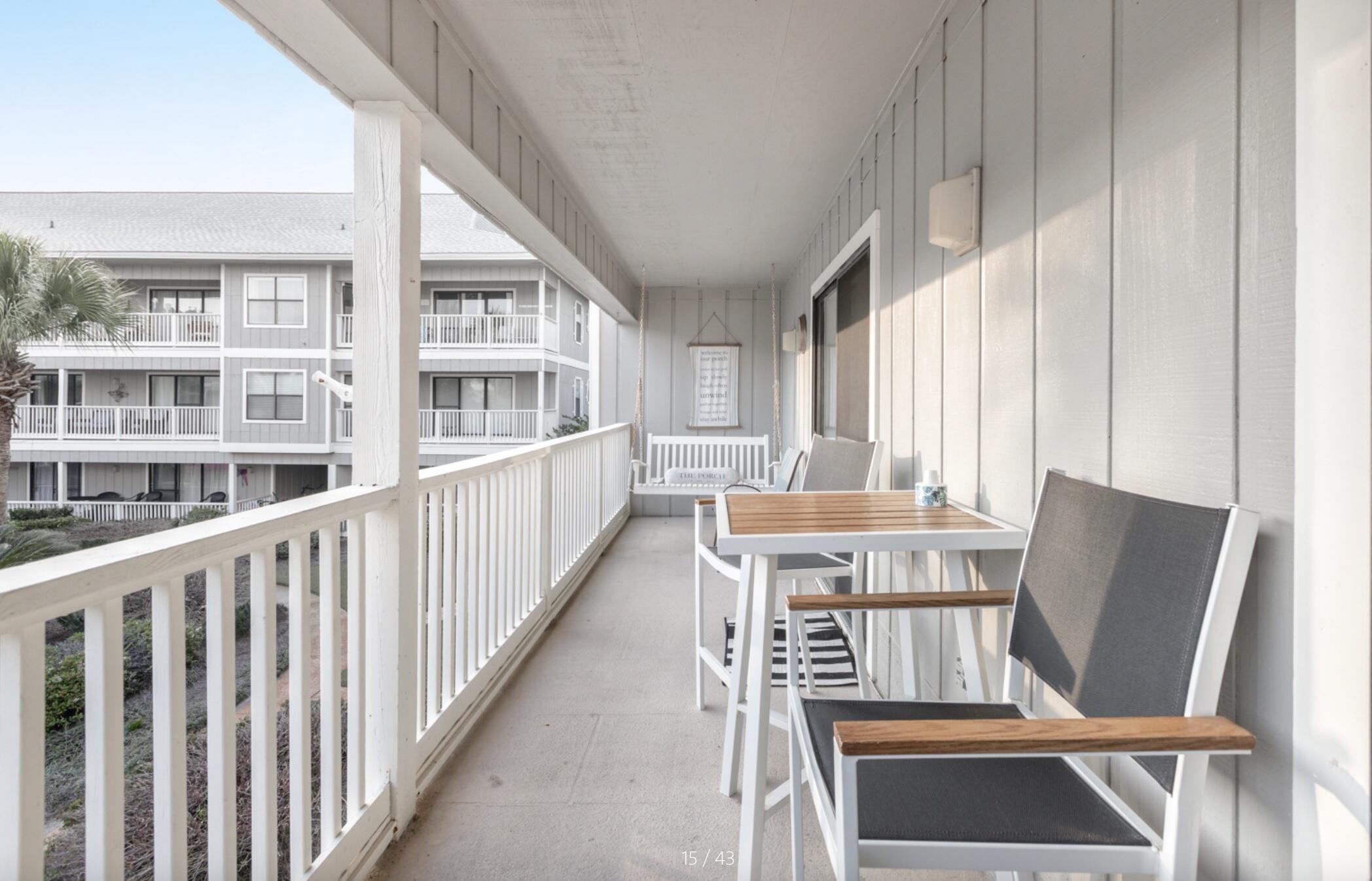 3799 East County Highway 30A, Unit E12 Santa Rosa Beach, FL 32459 - Photo 8 of 34 a view of a dining room with furniture window and wooden floor