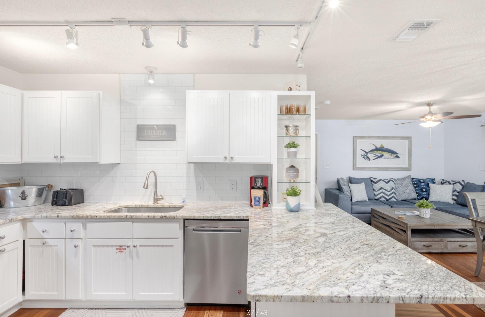 3799 East County Highway 30A, Unit E12 Santa Rosa Beach, FL 32459 - Photo 9 of 34 a kitchen with sink a stove and cabinets