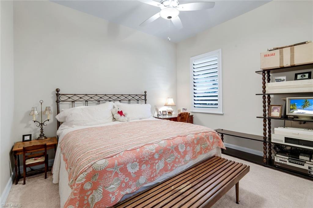 11050 Longwing Drive Fort Myers, FL 33912 - Photo 18 of 43 Bedroom with light carpet and a ceiling fan