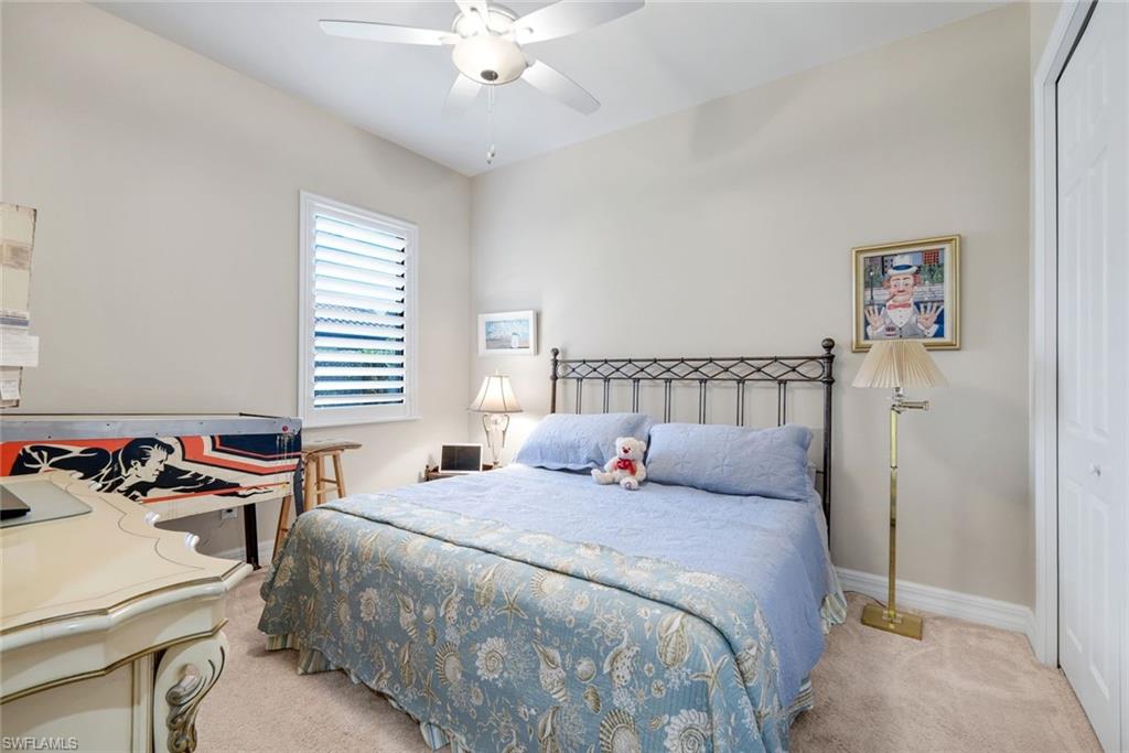 11050 Longwing Drive Fort Myers, FL 33912 - Photo 20 of 43 Carpeted bedroom with a closet and ceiling fan