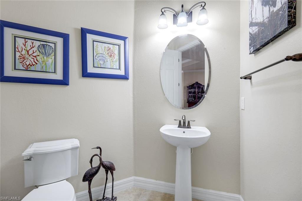 11050 Longwing Drive Fort Myers, FL 33912 - Photo 21 of 43 Bathroom featuring baseboards and tile patterned flooring