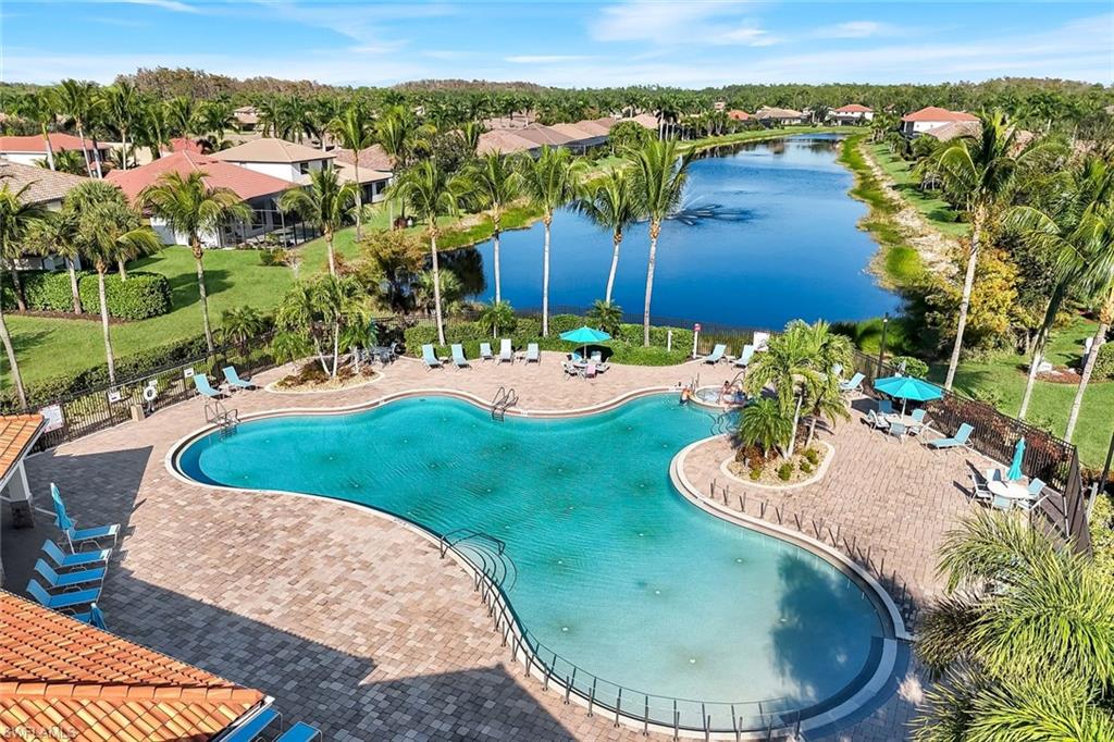11050 Longwing Drive Fort Myers, FL 33912 - Photo 33 of 43 Community pool featuring a water view, a patio, and a residential view