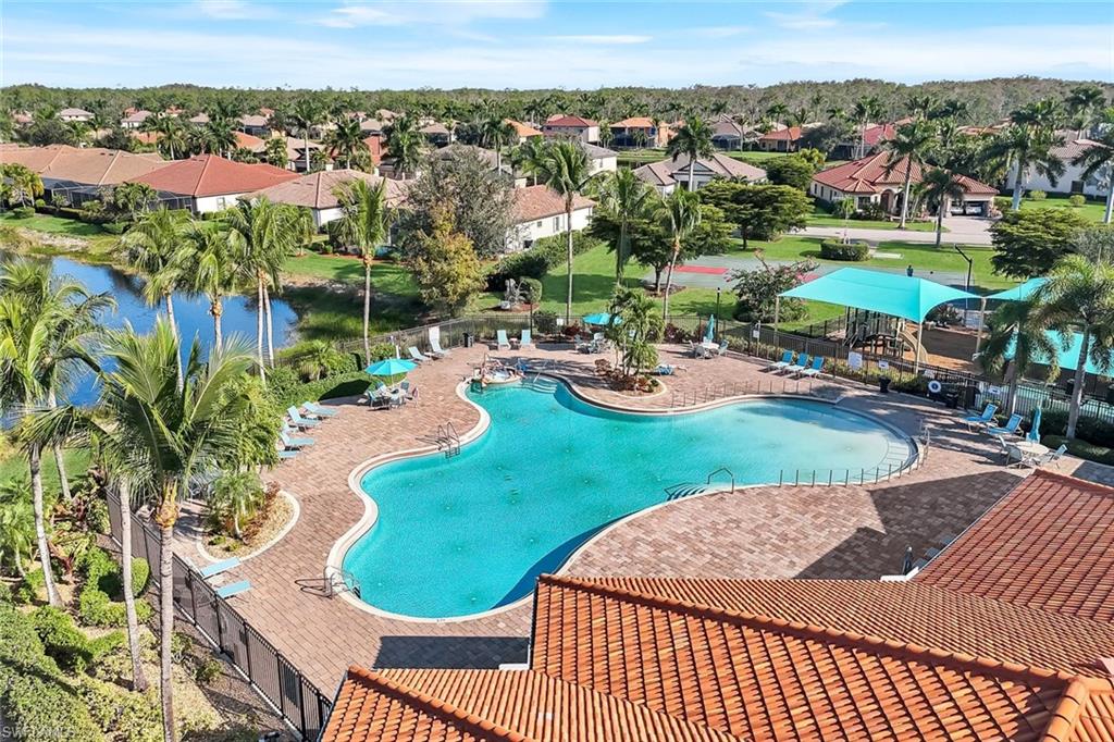 11050 Longwing Drive Fort Myers, FL 33912 - Photo 37 of 43 Community pool featuring a residential view and a patio