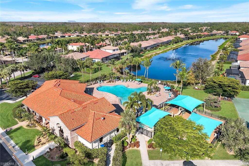 11050 Longwing Drive Fort Myers, FL 33912 - Photo 39 of 43 Aerial view of residential area featuring a large body of water and a pool