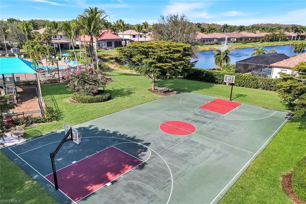 11050 Longwing Drive Fort Myers, FL 33912 - Photo 40 of 43 View of basketball court featuring a lawn, community basketball court, and a water view