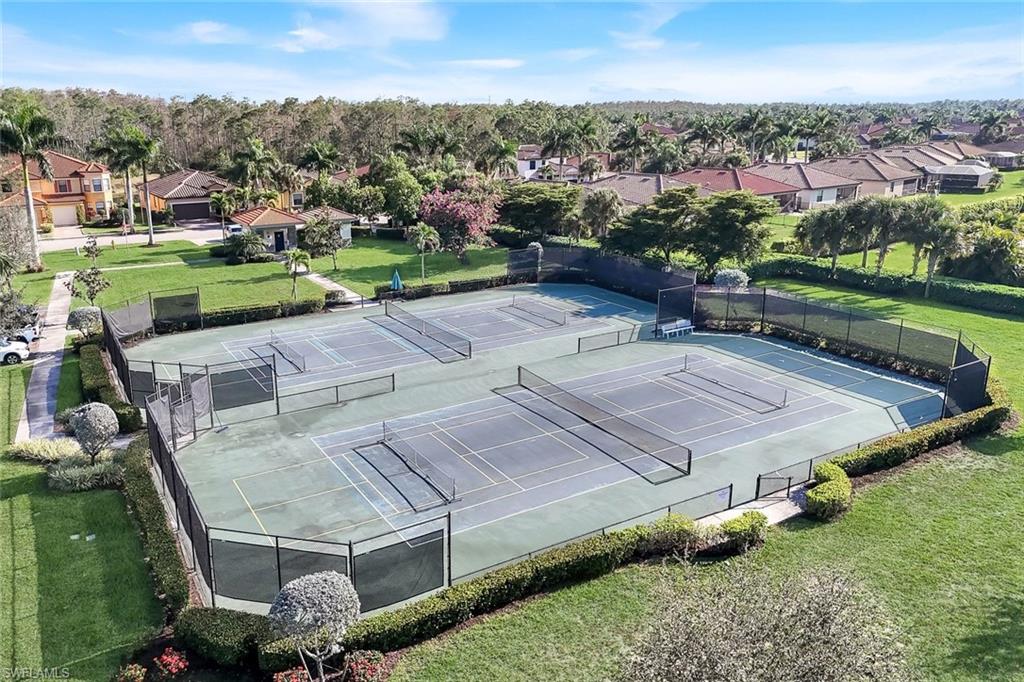 11050 Longwing Drive Fort Myers, FL 33912 - Photo 41 of 43 View of tennis court with a residential view