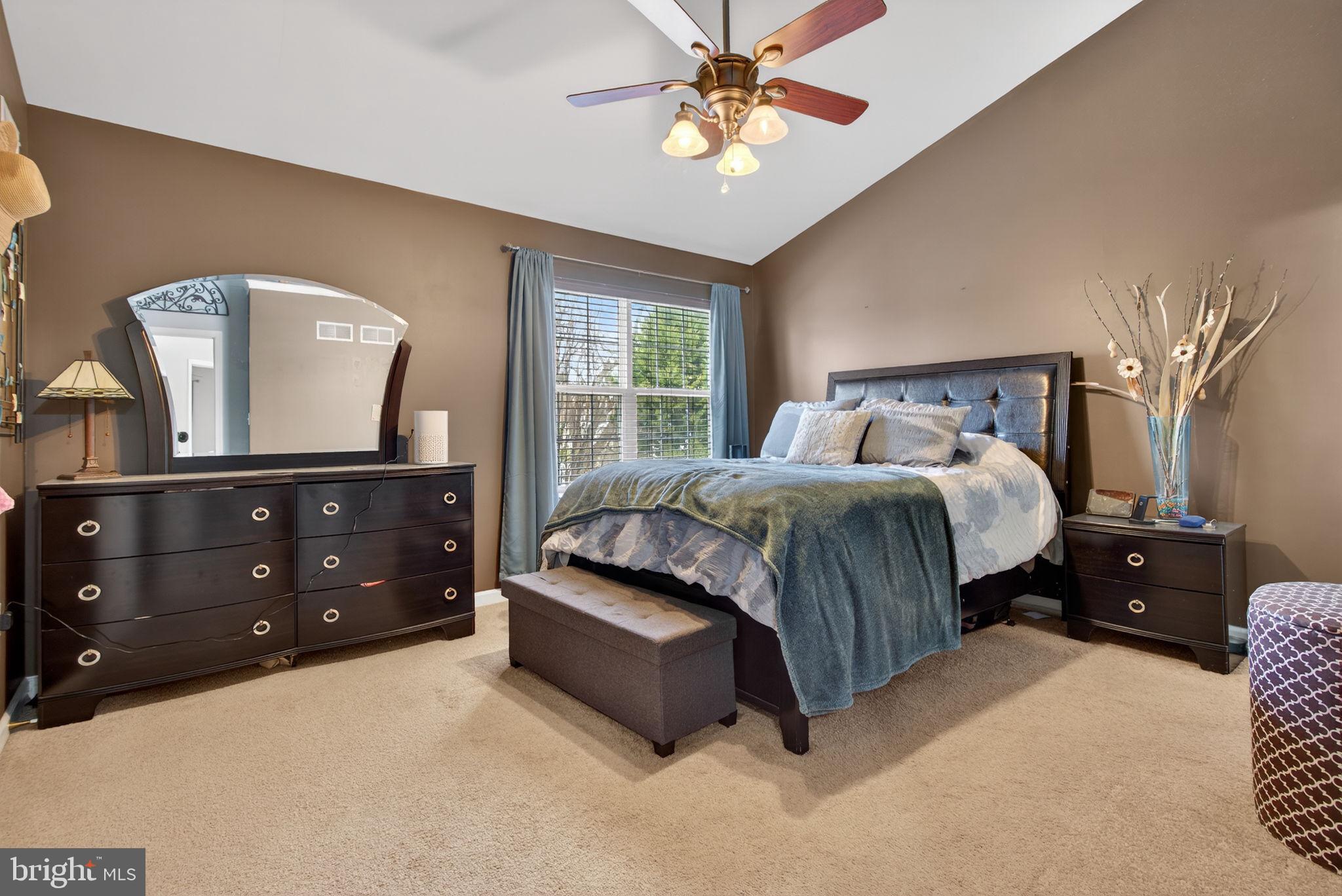2436 Schultz Way, Unit 19 York, PA 17402 - Photo 16 of 30 a spacious bedroom with a bed and a dresser