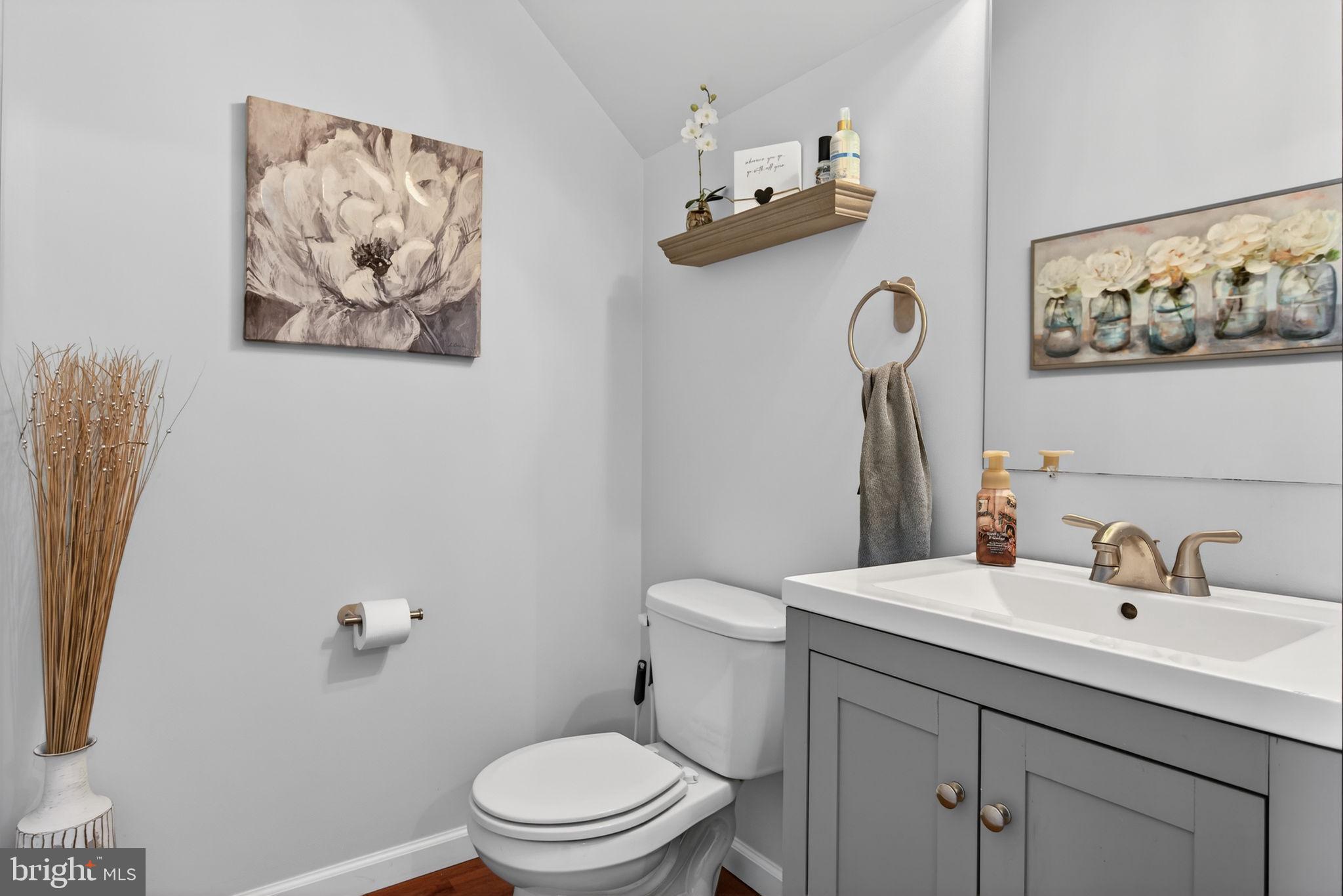 2436 Schultz Way, Unit 19 York, PA 17402 - Photo 19 of 30 a bathroom with a toilet sink and mirror