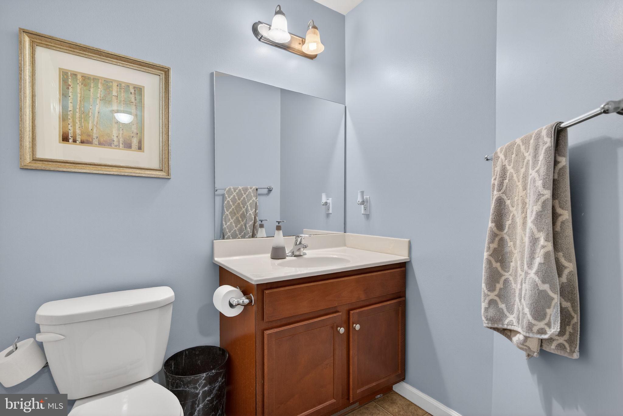 2436 Schultz Way, Unit 19 York, PA 17402 - Photo 26 of 30 a bathroom with a toilet sink and mirror