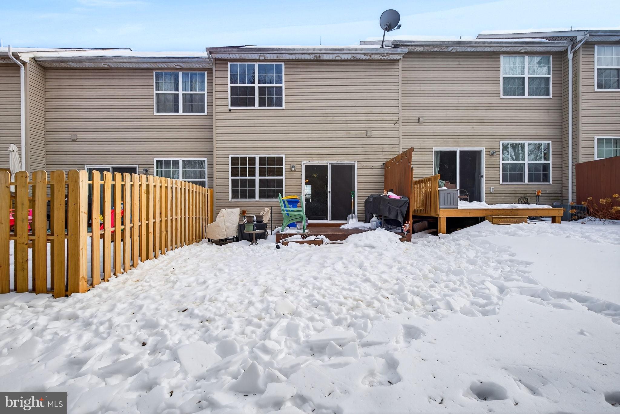 2436 Schultz Way, Unit 19 York, PA 17402 - Photo 28 of 30 a view of a dinning table and chairs in the patio