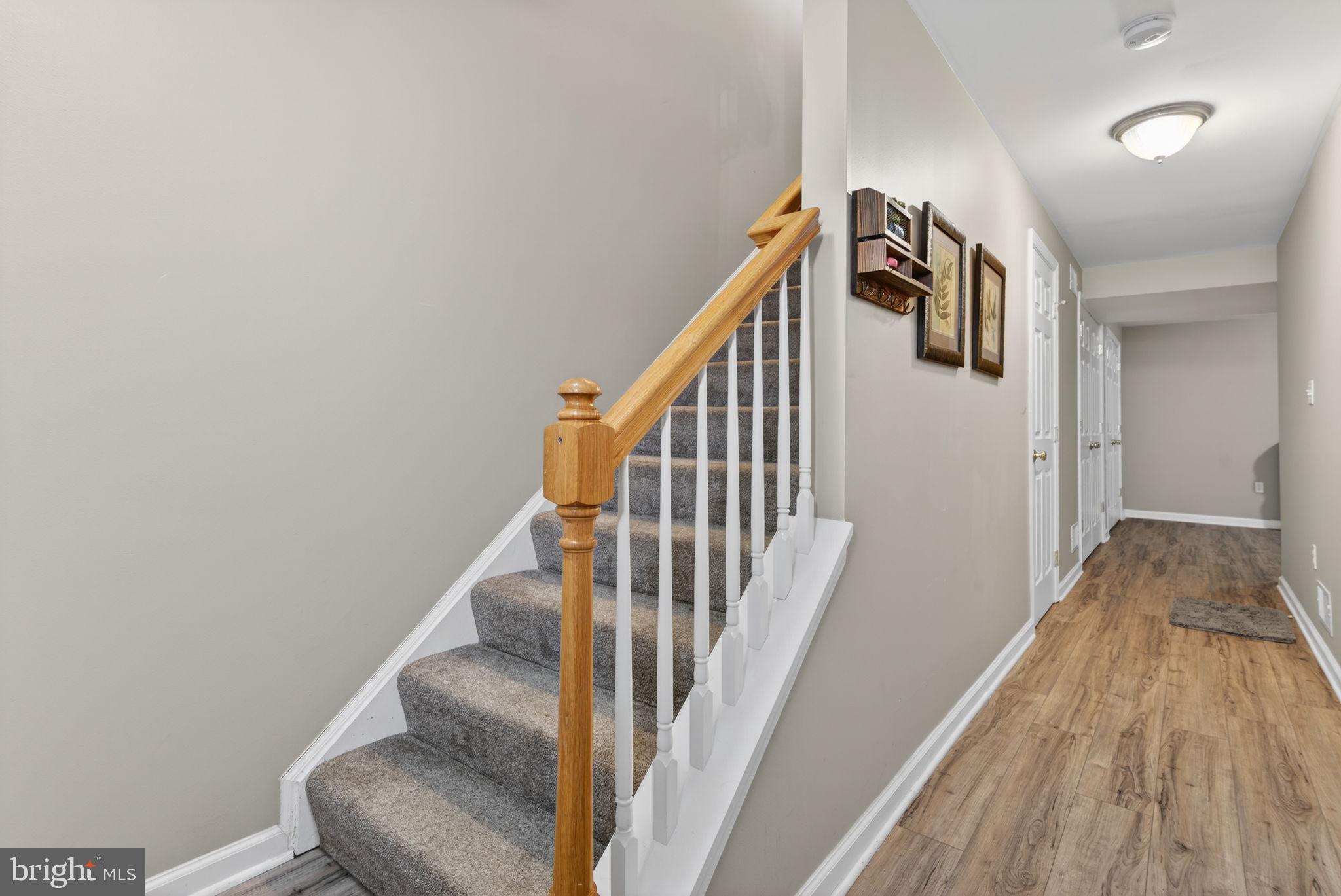 2436 Schultz Way, Unit 19 York, PA 17402 - Photo 5 of 30 a view of staircase with wooden floor and white walls