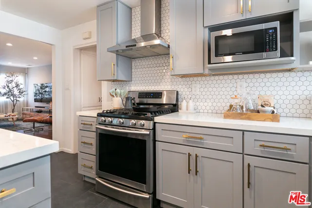 a kitchen with a table and chairs in it