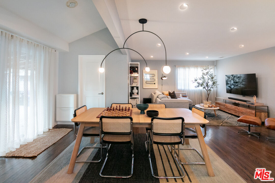 2415 8th Avenue Los Angeles, CA 90018 - Photo 21 of 55 a living room with furniture and a flat screen tv