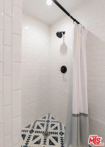 a bedroom with bed and a window