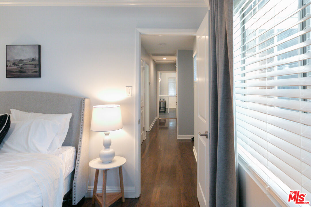 2415 8th Avenue Los Angeles, CA 90018 - Photo 32 of 55 a view of a room with wooden floor and furniture
