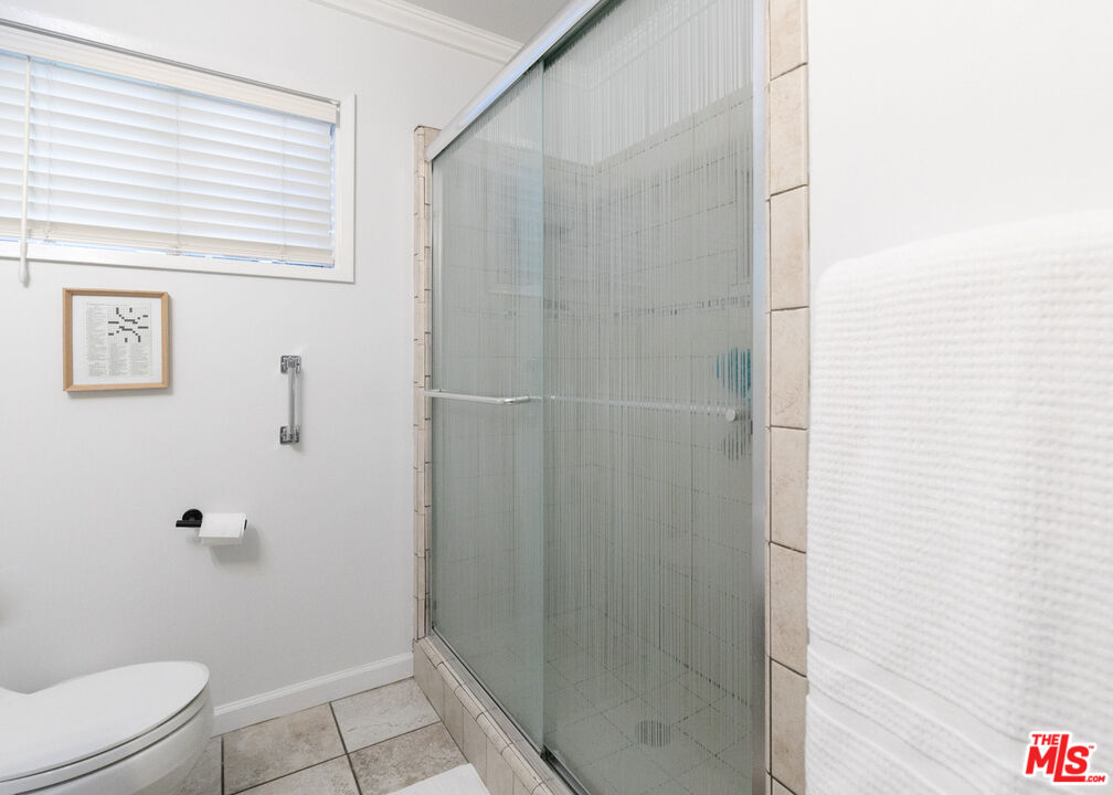 2415 8th Avenue Los Angeles, CA 90018 - Photo 35 of 55 a bathroom with a shower and toilet