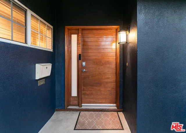 a view of door with wooden floor