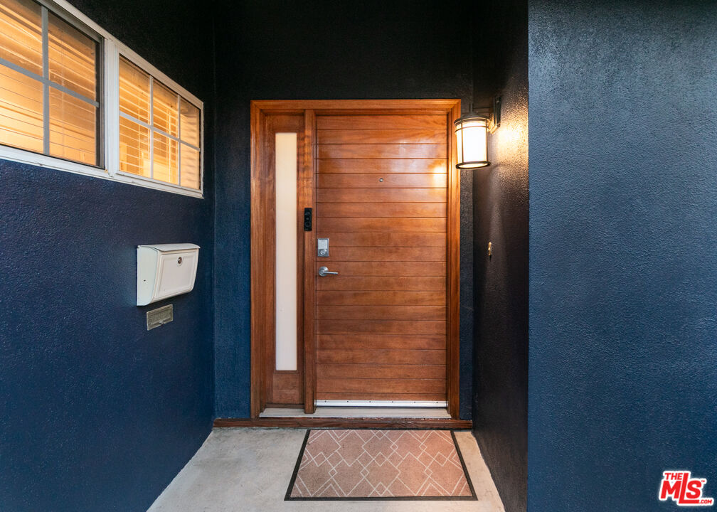 2415 8th Avenue Los Angeles, CA 90018 - Photo 4 of 55 a view of door with wooden floor