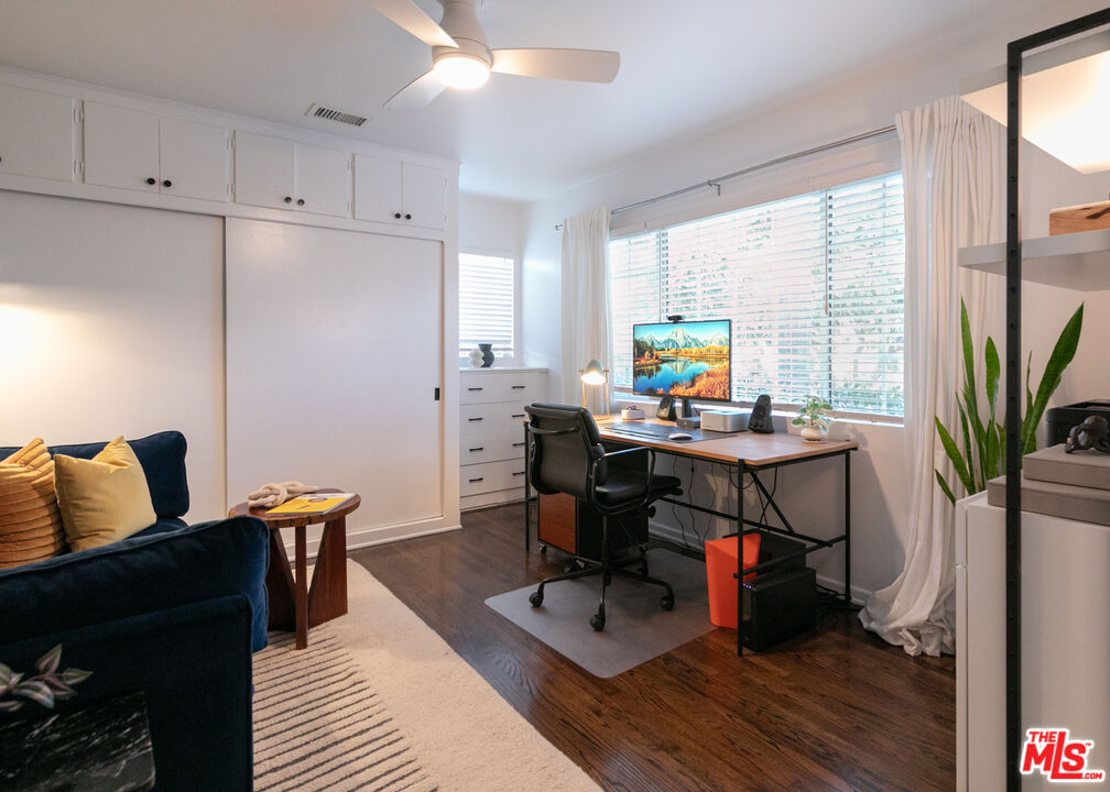 2415 8th Avenue Los Angeles, CA 90018 - Photo 41 of 55 a view of a workspace with furniture and a potted plant