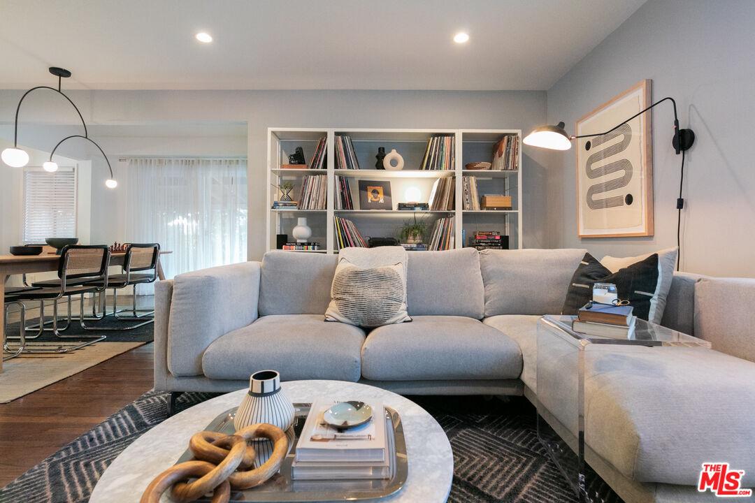 2415 8th Avenue Los Angeles, CA 90018 - Photo 9 of 55 a living room with furniture and a wooden floor