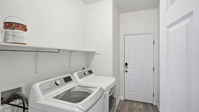 a utility room with dryer and washer
