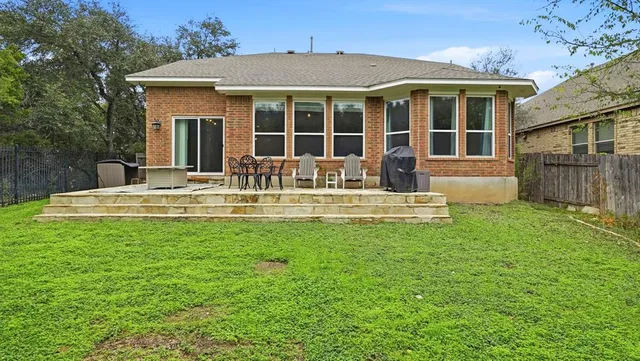 a view of a house with a yard porch and sitting area