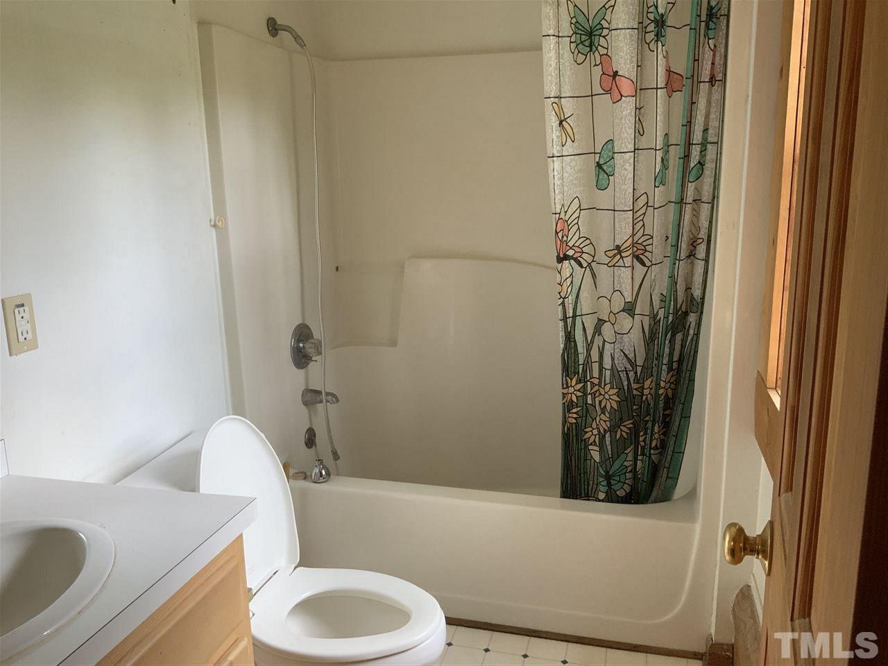 4 Dawn Road Benson, NC 27504 - Photo 18 of 19 a bathroom with a toilet and shower