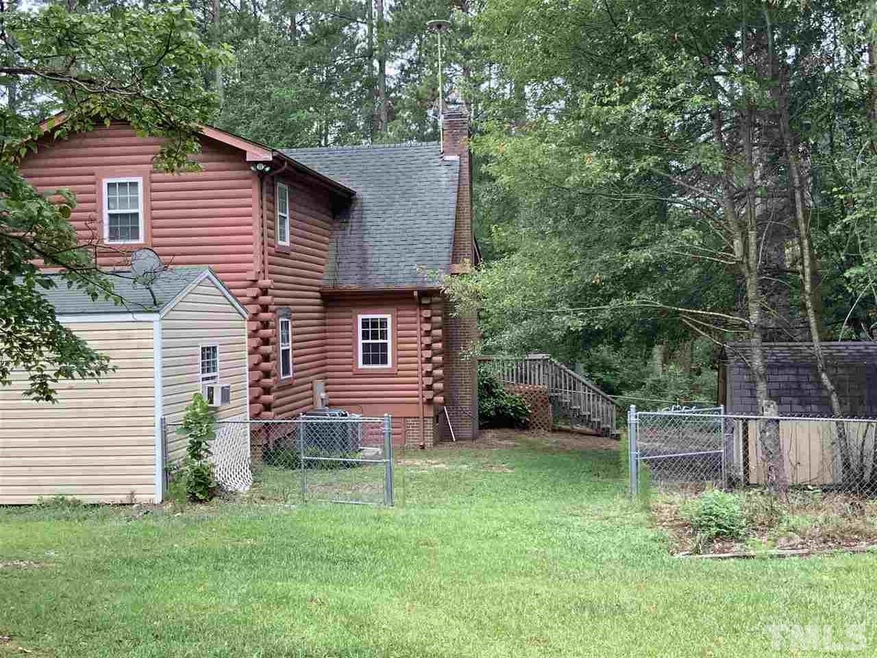 4 Dawn Road Benson, NC 27504 - Photo 3 of 19 a view of a house with a backyard