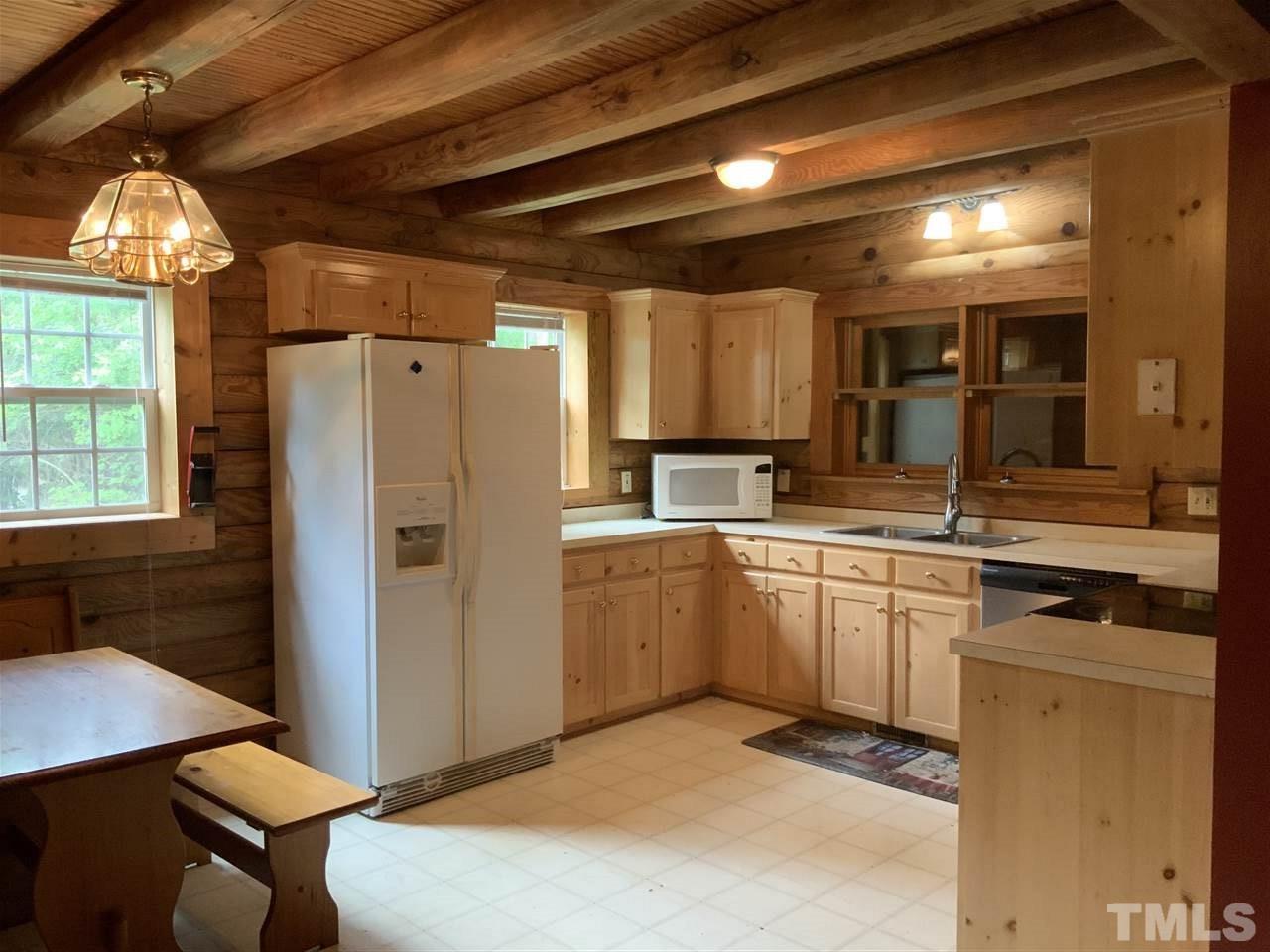4 Dawn Road Benson, NC 27504 - Photo 5 of 19 a kitchen with refrigerator and window