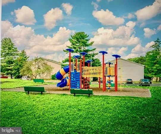 a view of a park with large trees