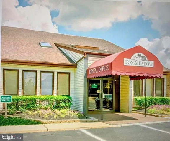 front view of a brick building with a window
