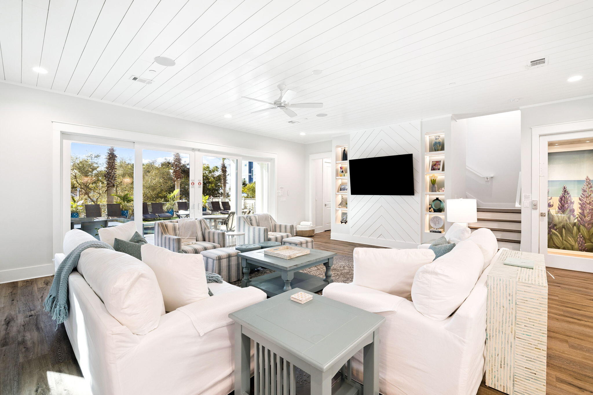 230 Blue Lake Road Santa Rosa Beach, FL 32459 - Photo 26 of 110 a living room with furniture and a flat screen tv