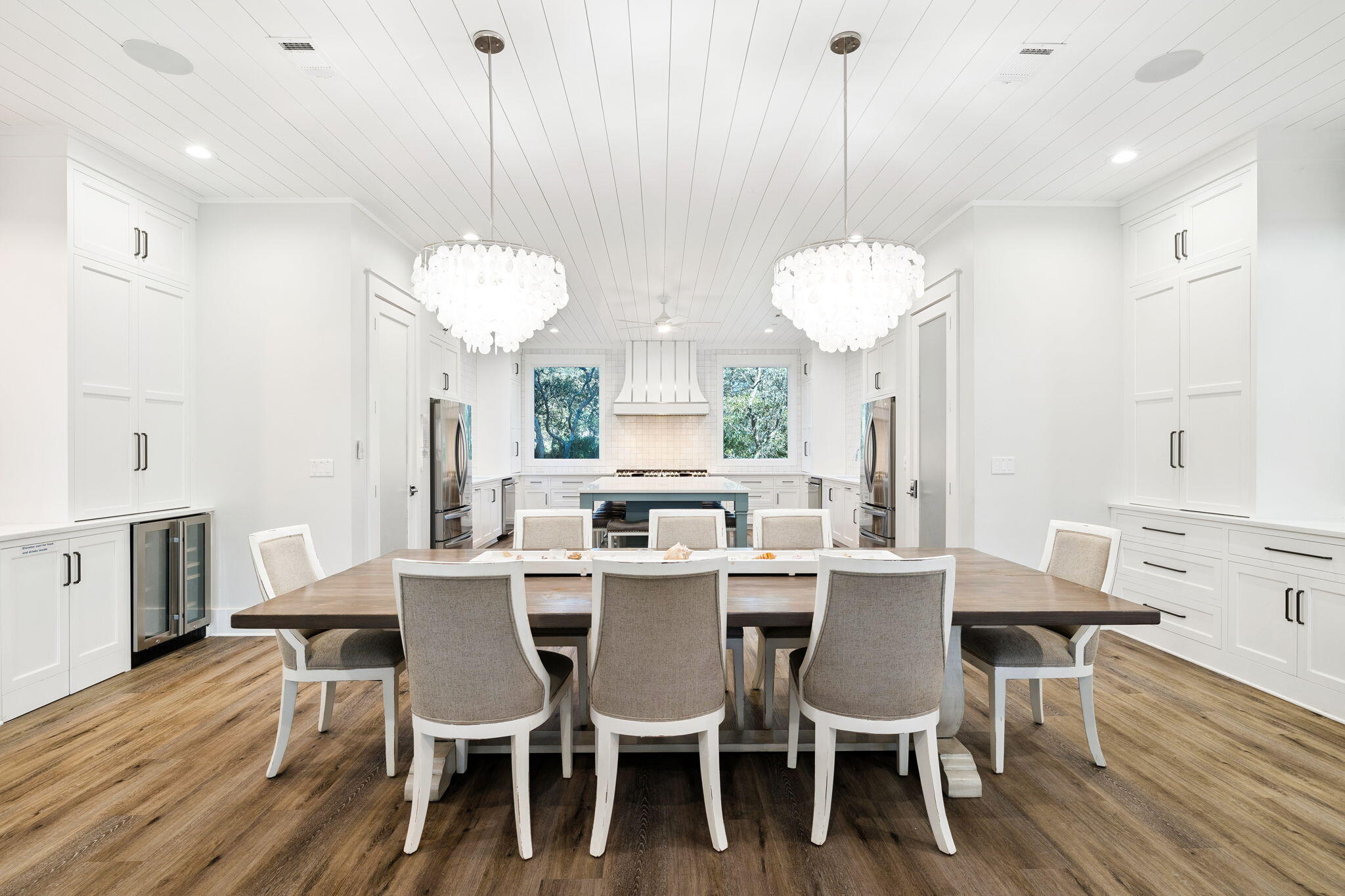 230 Blue Lake Road Santa Rosa Beach, FL 32459 - Photo 28 of 110 a dining room with furniture a chandelier and wooden floor