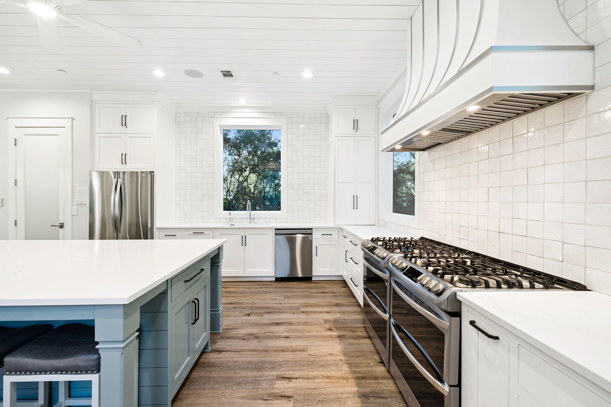 230 Blue Lake Road Santa Rosa Beach, FL 32459 - Photo 31 of 110 a kitchen with a stove and a white refrigerator