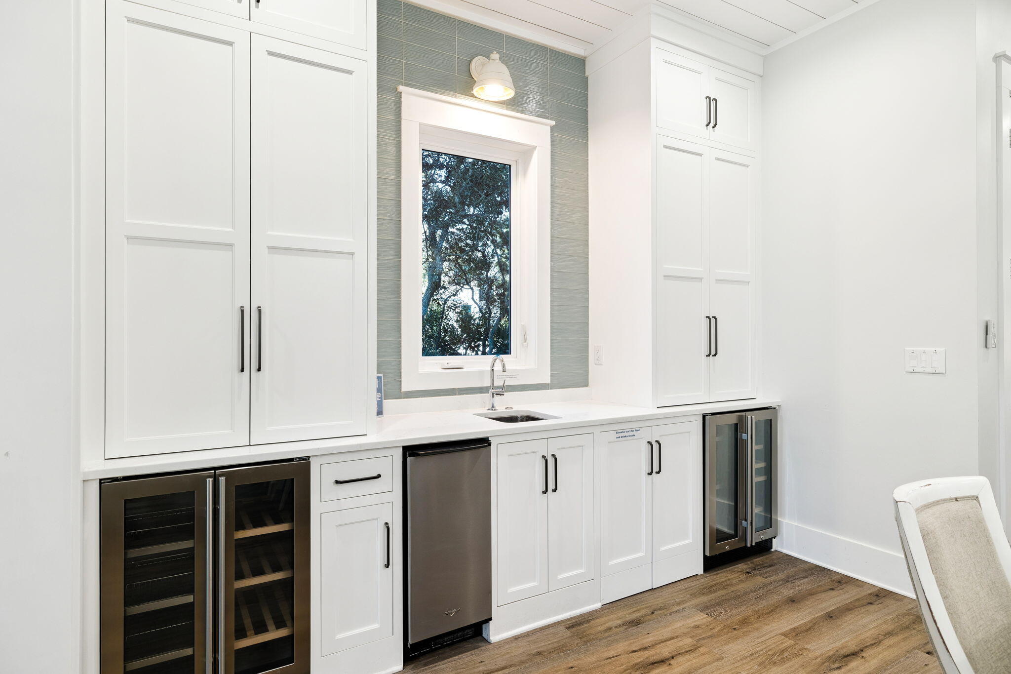 230 Blue Lake Road Santa Rosa Beach, FL 32459 - Photo 34 of 110 a kitchen with a sink cabinets and window