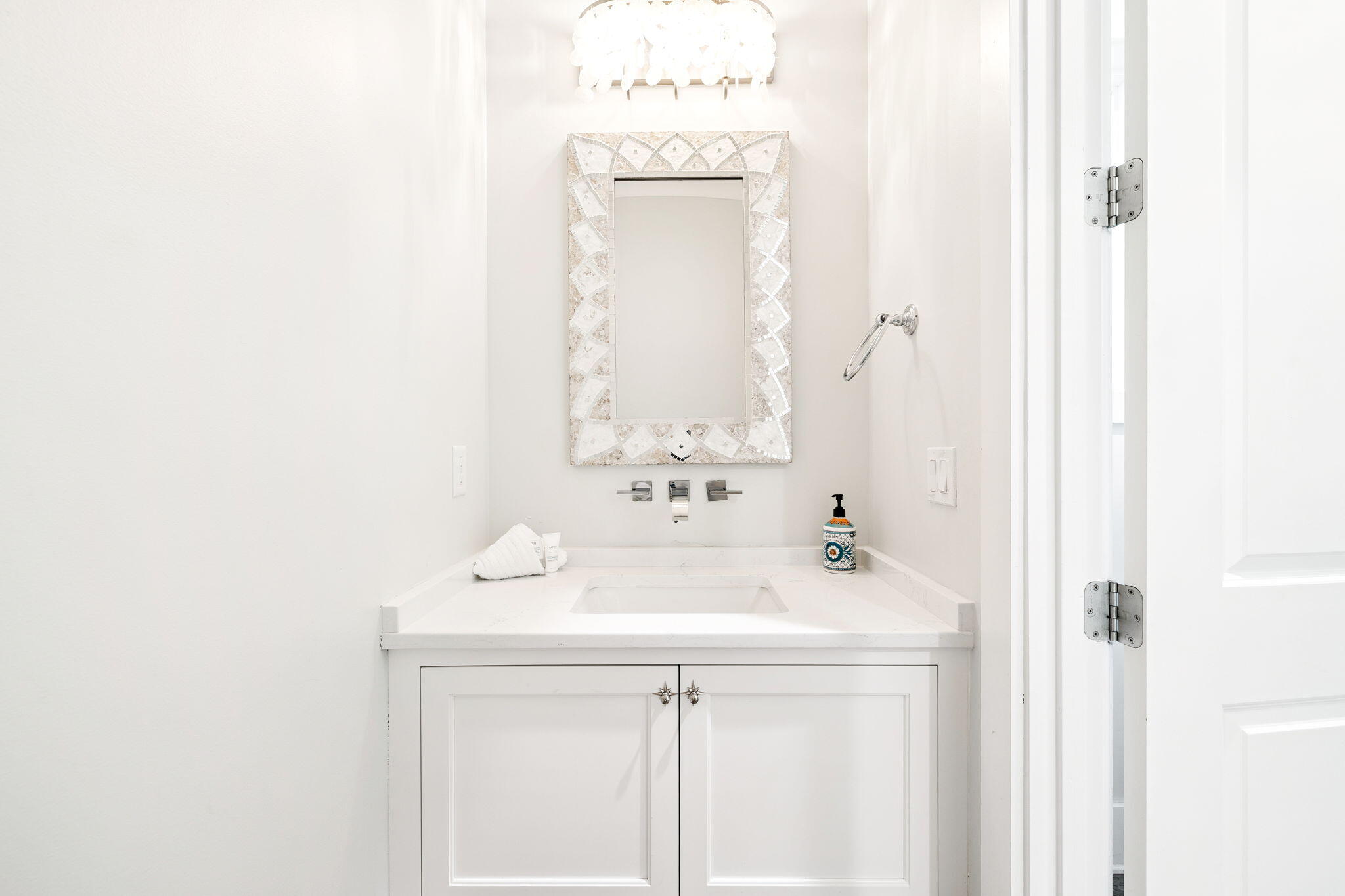 230 Blue Lake Road Santa Rosa Beach, FL 32459 - Photo 35 of 110 a bathroom with a sink a mirror and a vanity