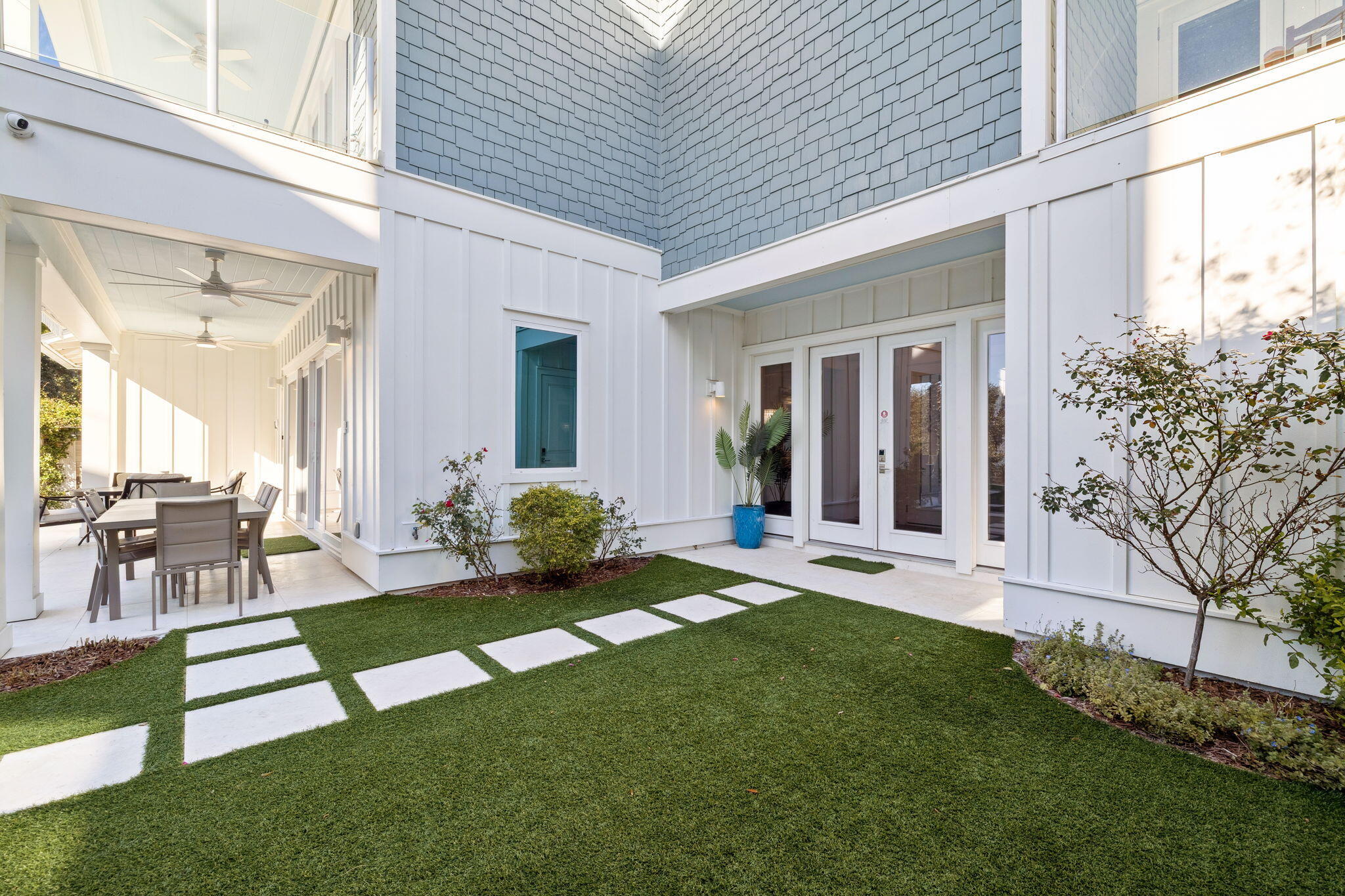 230 Blue Lake Road Santa Rosa Beach, FL 32459 - Photo 41 of 110 a view of a house with backyard and sitting area