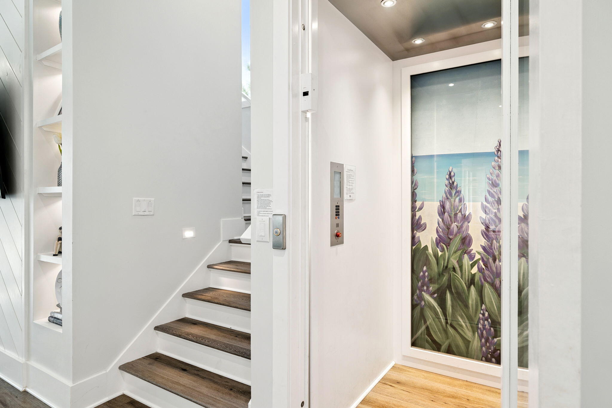230 Blue Lake Road Santa Rosa Beach, FL 32459 - Photo 52 of 110 a view of a hallway with paintings on the wall