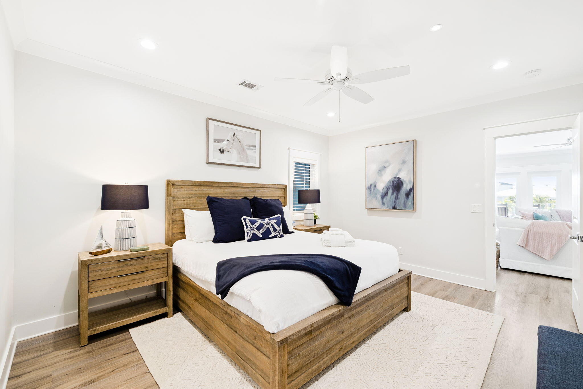 230 Blue Lake Road Santa Rosa Beach, FL 32459 - Photo 61 of 110 a bedroom with a bed and a couch