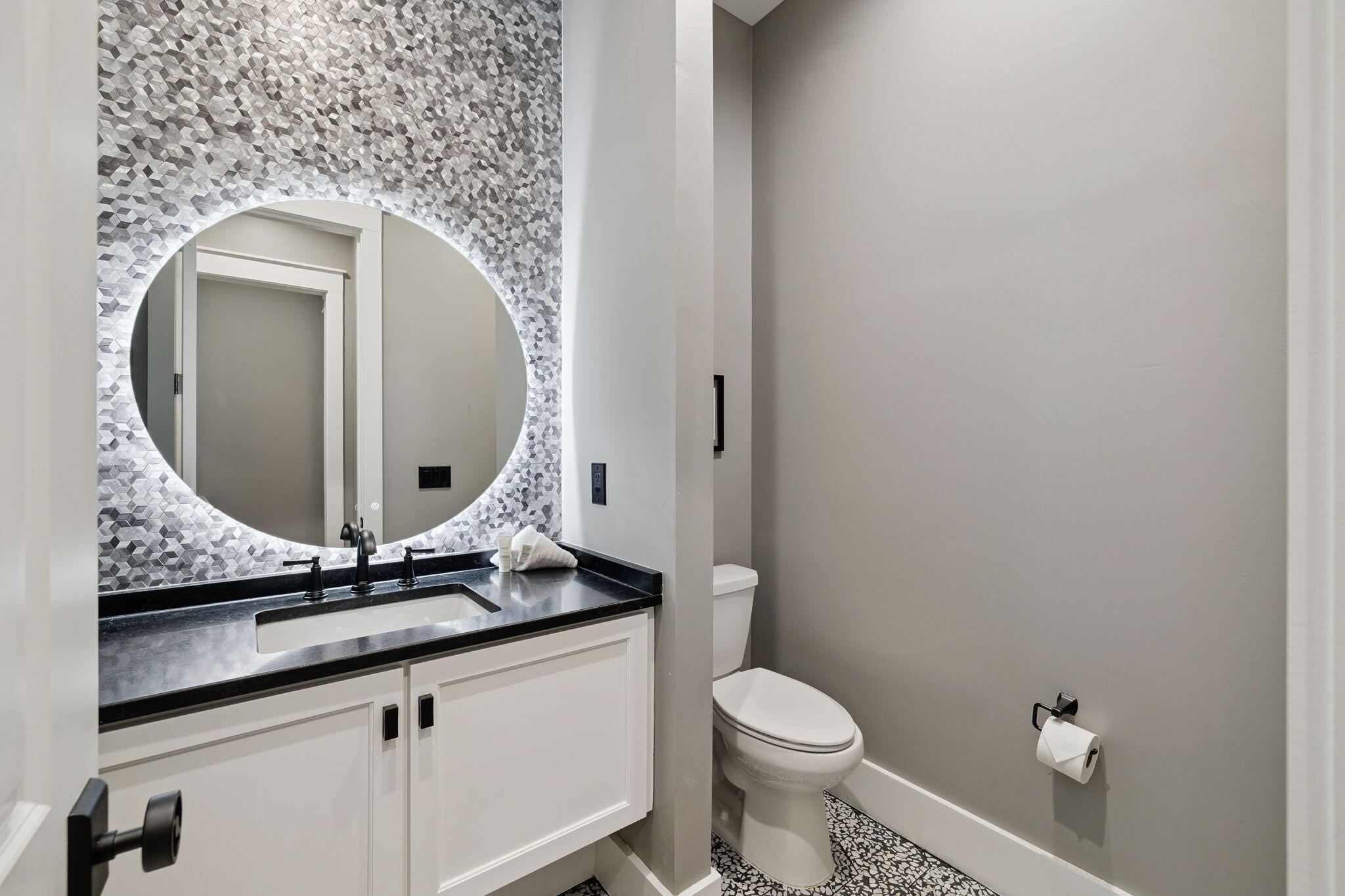230 Blue Lake Road Santa Rosa Beach, FL 32459 - Photo 97 of 110 a bathroom with a granite countertop toilet sink and mirror