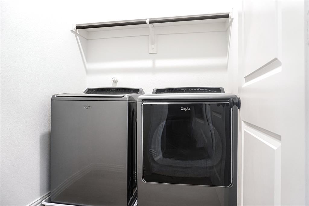 630 Blue Rdg Drive Mansfield, TX 76063 - Photo 21 of 27 a close up of a washer and dryer