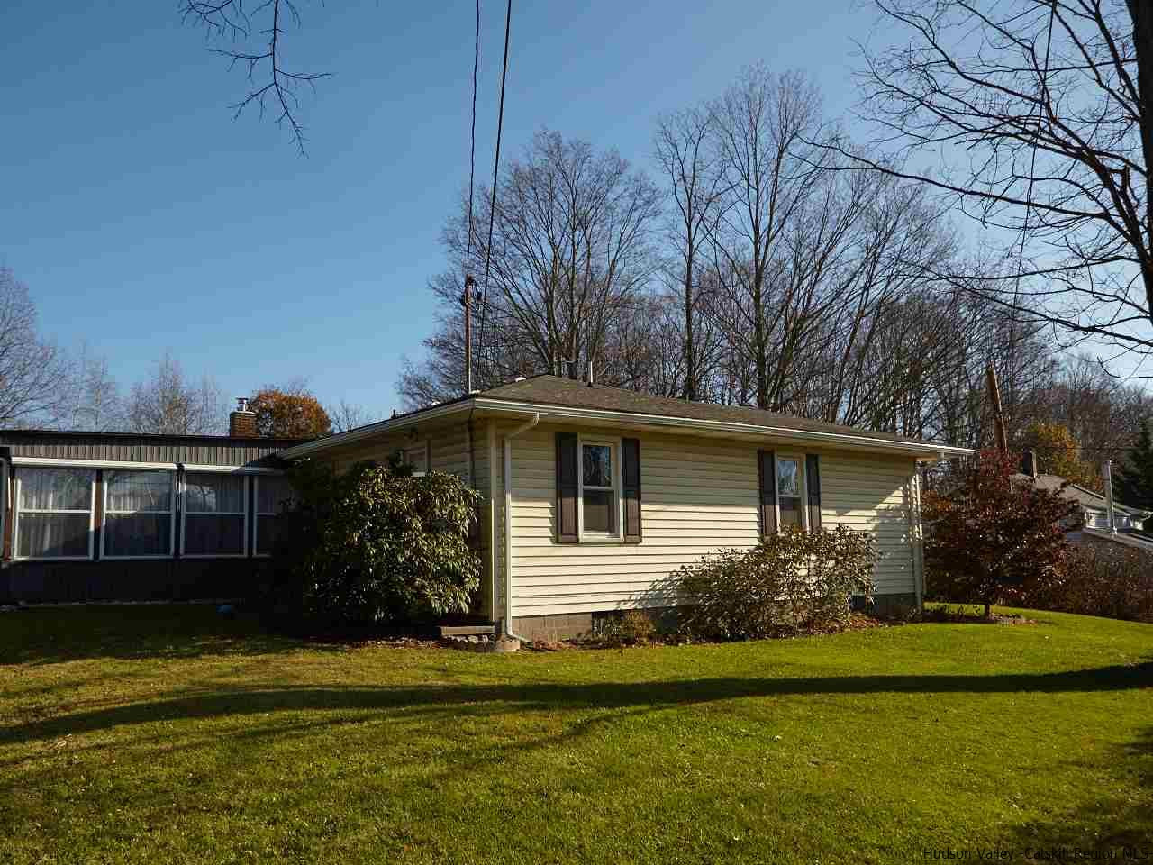 104 South Riverside Road Highland, NY 12528 - Photo 22 of 28 a front view of a house with a garden