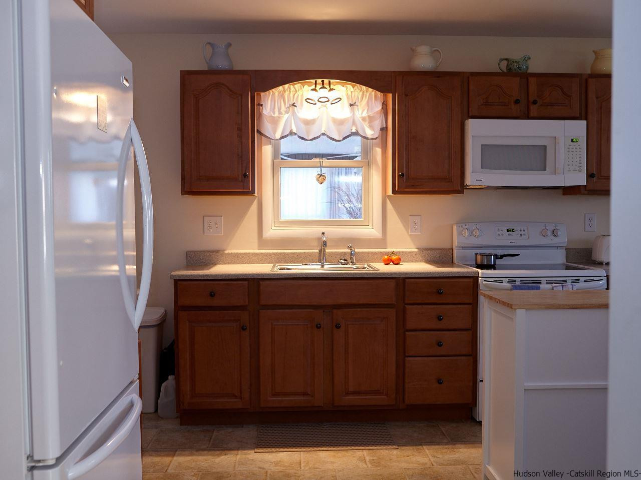 104 South Riverside Road Highland, NY 12528 - Photo 8 of 28 a bathroom with a sink and a mirror