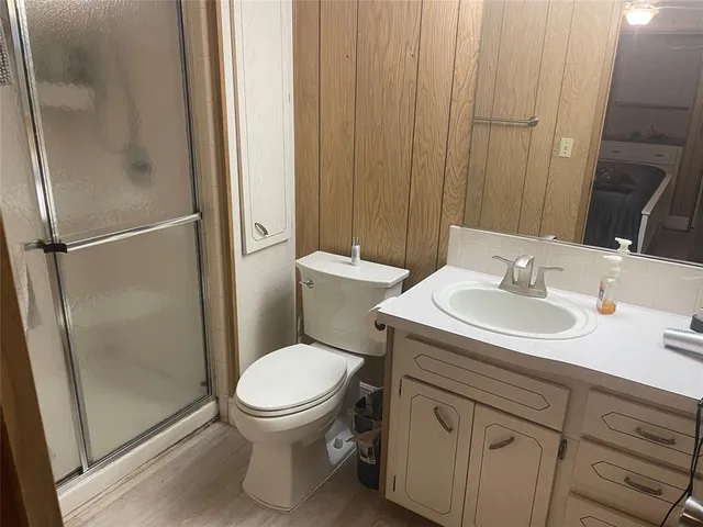 a bathroom with a sink toilet and a mirror