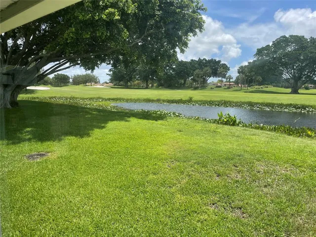 a view of a golf course with a lake