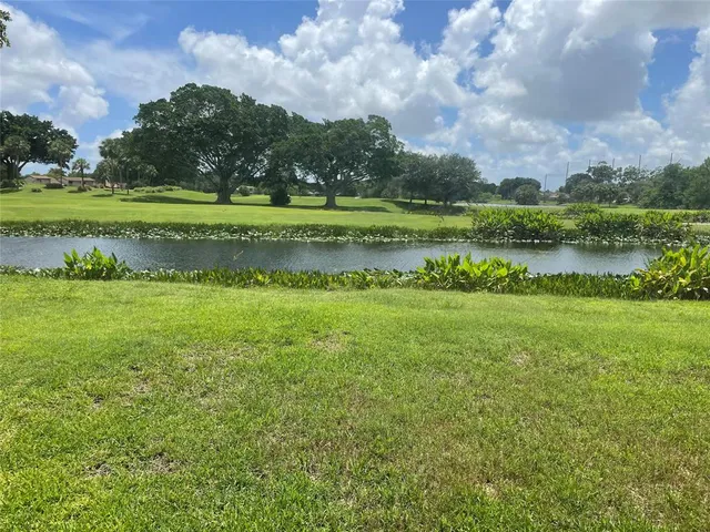 a view of a golf course with a lake