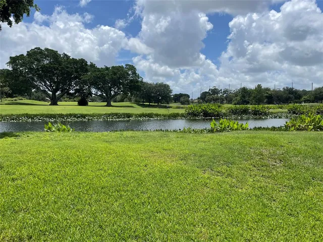 a view of a golf course with a lake