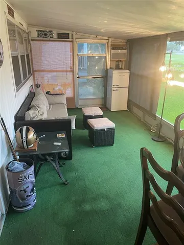 a room with furniture and a wooden floor