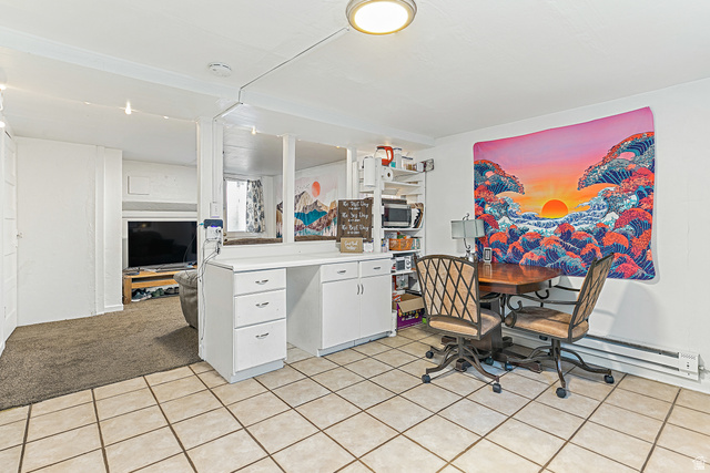 232 300 North Provo, UT 84606 - Photo 16 of 27 Office area featuring a baseboard heating unit, light tile patterned floors, and light carpet